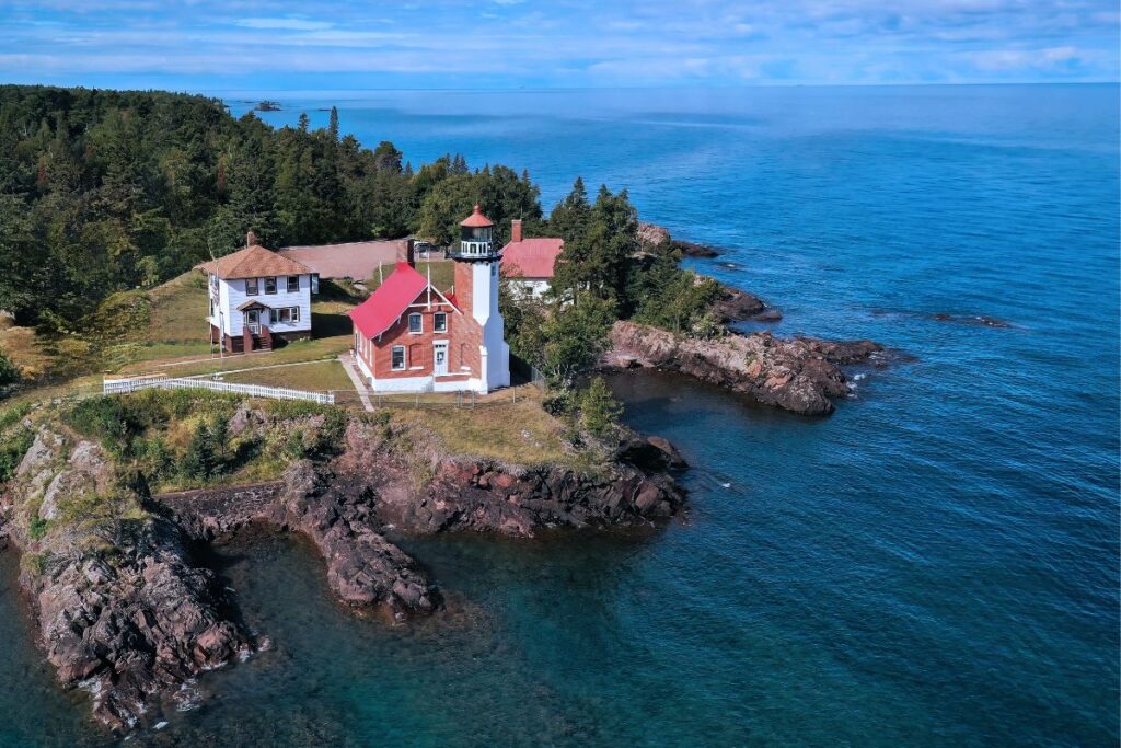 The Eagle Harbor Lighthouse on the rocky Lake Superior shoreline of the Keweenaw Peninsula in Michigan's Upper Peninsula