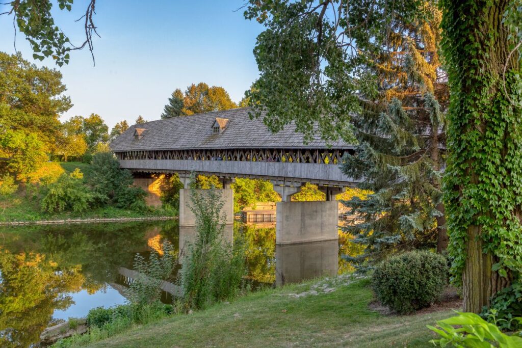 The 239-foot Holz-Brücke wooden covered bridge spans the Cass River near the Bavarian Inn in Frankenmuth, Michigan.