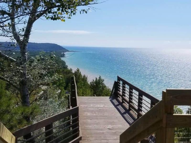 Scenic overlook of Lake Michigan from Northern Michigan — turquoise water and forested shoreline