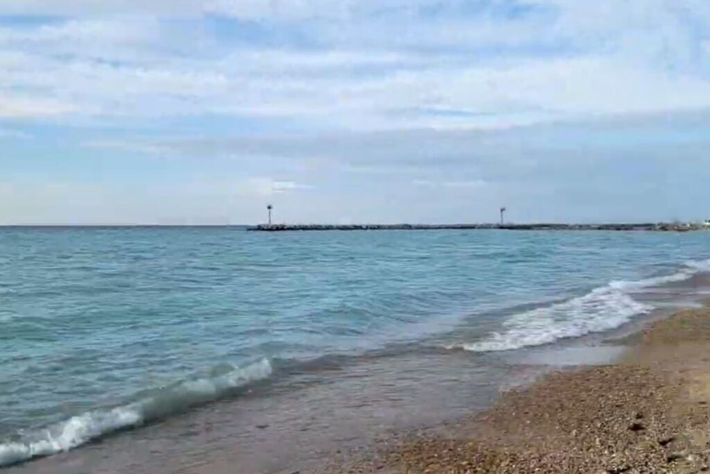 Looking down the sandy coast of Van's Beach in Leland Michigan, a prime spot for Leland Blue stone hunting.