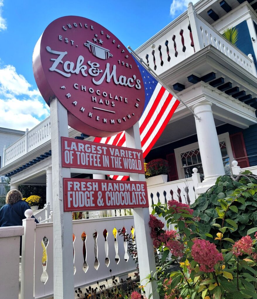 Zak & Mac's Chocolate Haus sign on Main Street Frankenmuth, Michigan — established 1981, known for handmade toffee and fudg